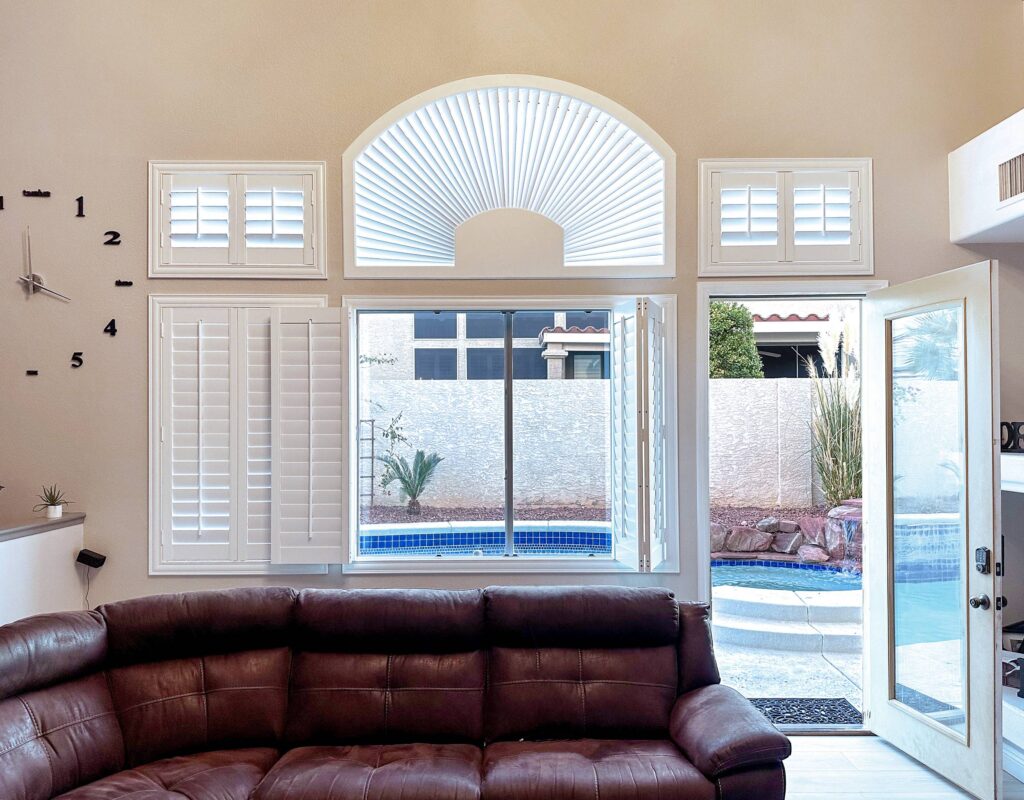 Stylish family room shutters open up to the pool view.